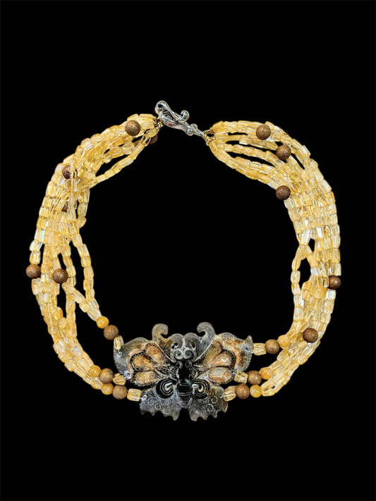 Citrine chocker with moth carving
