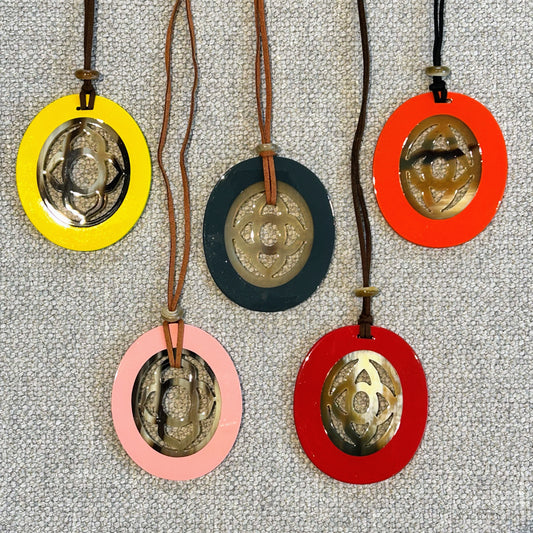 Oval buffalo horn and lacquer pendant