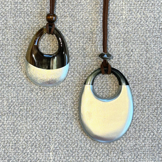 Oval buffalo horn and silver lacquer pendant