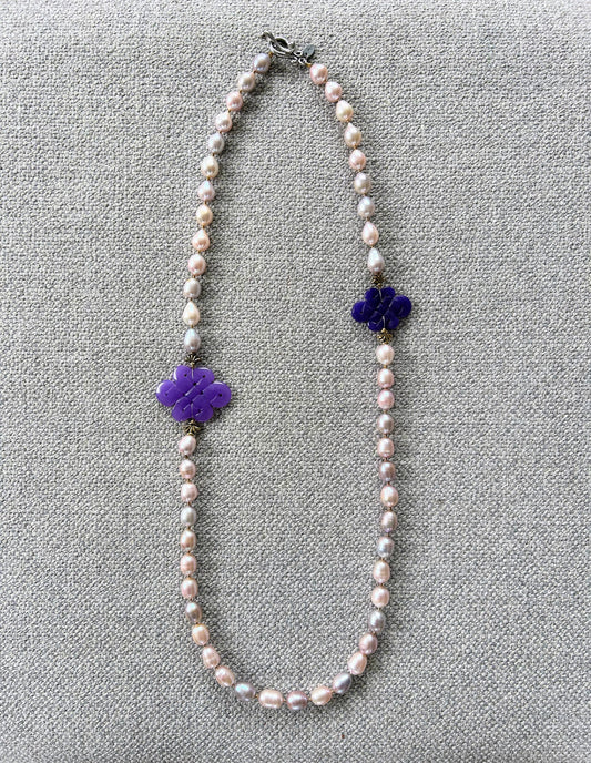 Freshwater pearl necklace with purple jade infinity knot carvings