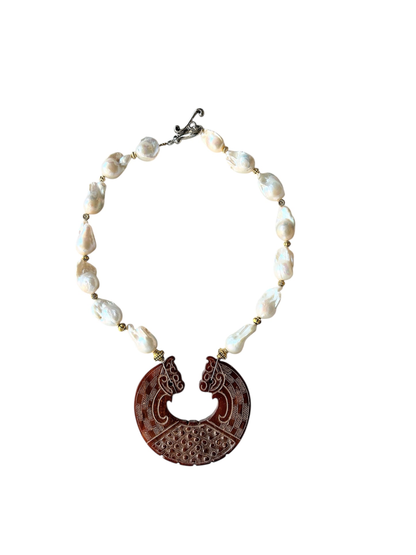 Large baroque freshwater pearl choker with a carving in the shape 2 lions