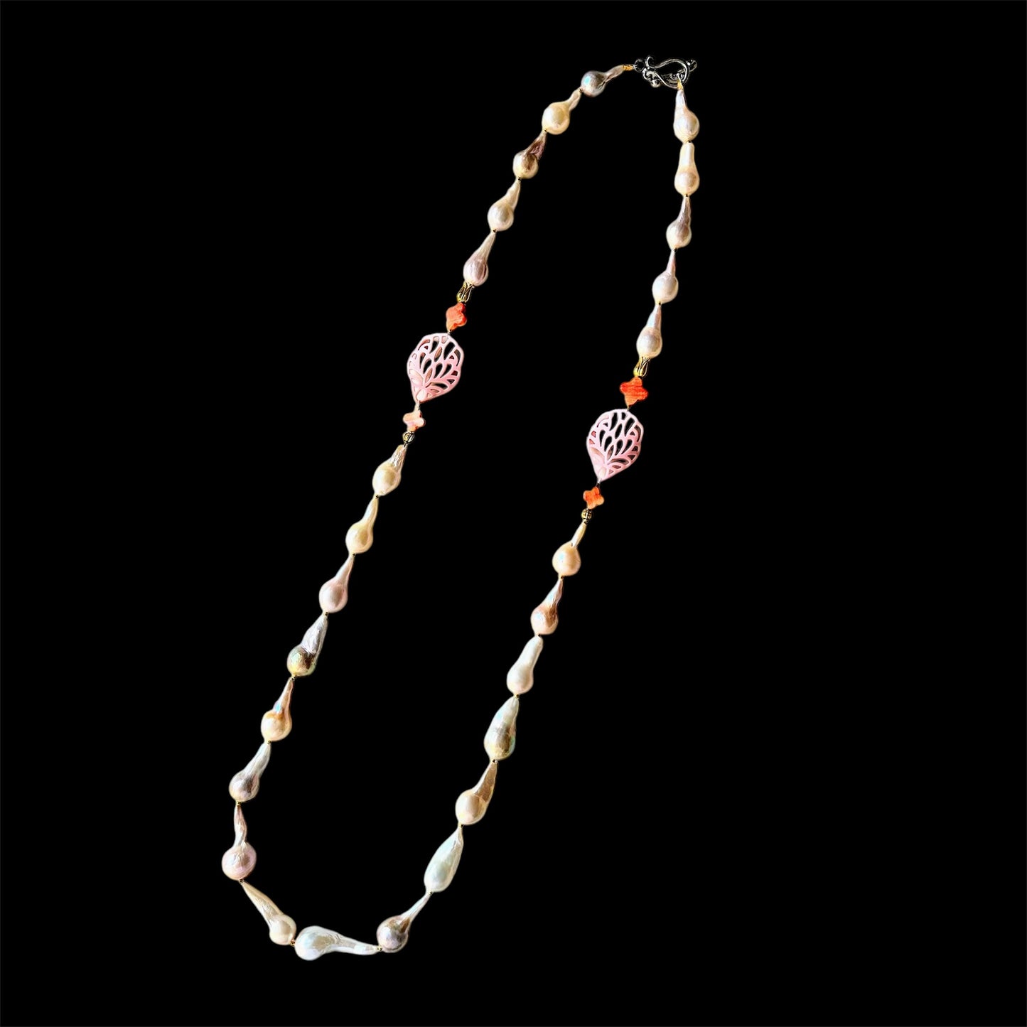 Elongated baroque freshwater pearl and conch shell necklace